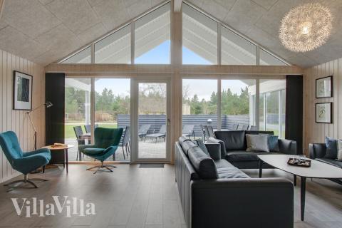 Aufenthaltsraum mit Platz für 18 im Luxusferienhaus Nr. 409.