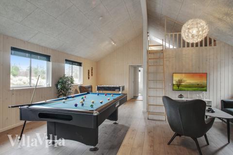 Das Luxusferienhaus 409 für 18 Personen hat einen großen Aktivitätsraum mit u. a. Billard und Darts
