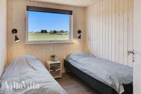 Eines der 9 Schlafzimmer im Luxusferienhaus Nr. 403