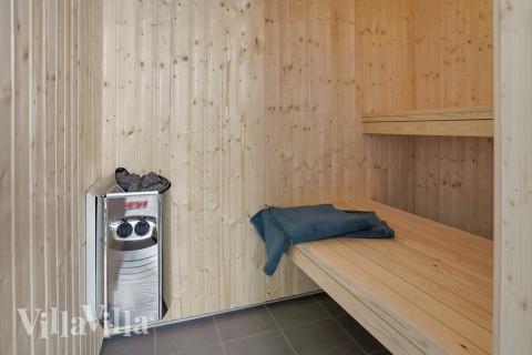 Genießen Sie die heiße Sauna im Luxusferienhaus Nr. 413 für 20 Personen