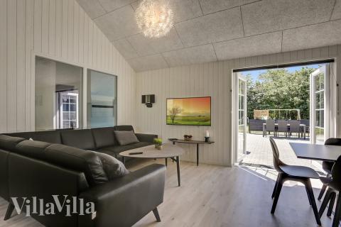 Der Aufenthaltsraum bietet Platz für 24 Personen, wenn ihr das Ferienhaus 419 in Westjütland besucht.