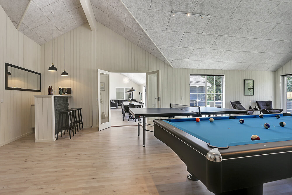 Neben den vielen schönen Stunden, die man im Poolbereich des Hauses verbringen kann, bietet das Luxusferienhaus 419 auch Spielevergnügen bei Billard/Tischtennis und Darts