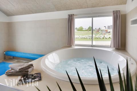 Genießen Sie den warmen Whirlpool im Luxusferienhaus Nr. 418 in Fünen und seine Inseln