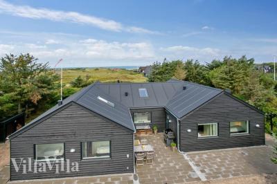 Dieses schöne Poolhaus Nr. 411 mit Platz für 14 Personen liegt in Nordjütland