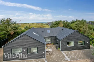 Luxusferienhaus Nr. 411 mit Meerblick und Pool in Blokhus, Nordjütland