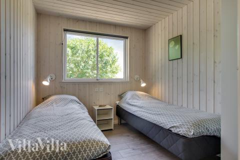 Eines der 6 Schlafzimmer im Luxusferienhaus Nr. 421