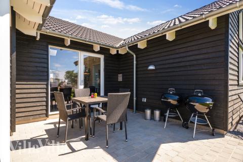 Genießen Sie einen Grillabend auf der Terrasse des Luxusferienhauses Nr. 717 in Deutschland