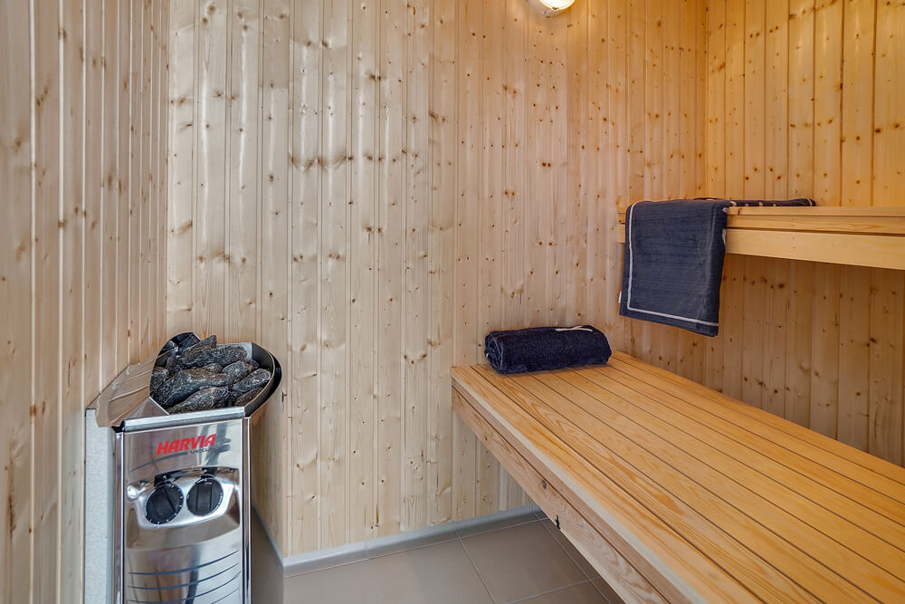 Genießen Sie die heiße Sauna im Luxusferienhaus Nr. 716 für 16 Personen
