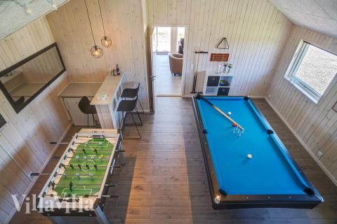 Neben den vielen schönen Stunden, die man im Poolbereich des Hauses verbringen kann, bietet das Luxusferienhaus 722 auch Spielevergnügen bei Billard/Tischtennis und Darts