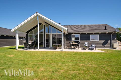 Genießen Sie einen Grillabend auf der Terrasse des Luxusferienhauses Nr. 718 in Deutschland