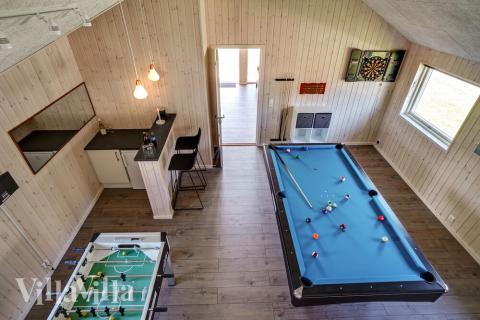 Neben den vielen schönen Stunden, die man im Poolbereich des Hauses verbringen kann, bietet das Luxusferienhaus 718 auch Spielevergnügen bei Billard/Tischtennis und Darts