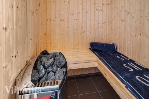 Genießen Sie die heiße Sauna im Luxusferienhaus Nr. 718 für 12 Personen