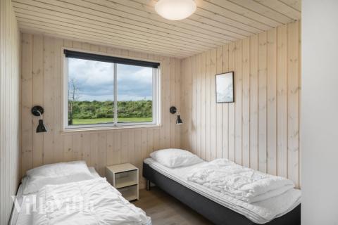 Eines der 9 Schlafzimmer im Luxusferienhaus Nr. 440