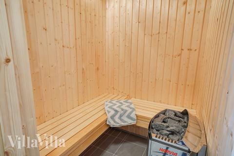 Genießen Sie die heiße Sauna im Luxusferienhaus Nr. 719 für 10 Personen