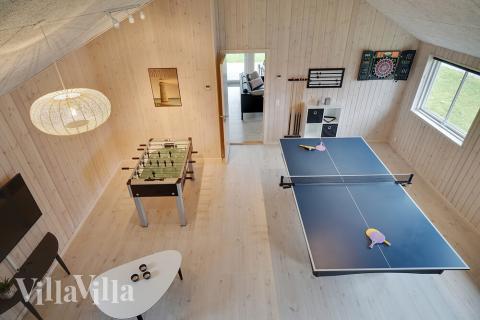 Neben den vielen schönen Stunden, die man im Poolbereich des Hauses verbringen kann, bietet das Luxusferienhaus 721 auch Spielevergnügen bei Billard/Tischtennis und Darts