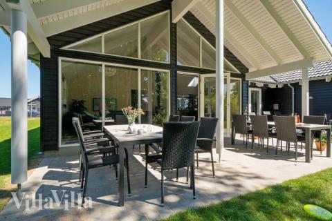 Genießen Sie einen Grillabend auf der Terrasse des Luxusferienhauses Nr. 720 in Deutschland