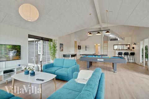 Aufenthaltsraum mit Platz für 26 im Luxusferienhaus Nr. 442.