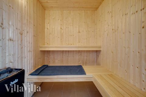 Genießen Sie die heiße Sauna im Luxusferienhaus Nr. 441 für 26 Personen
