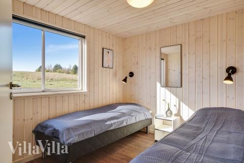 Eines der 12 Schlafzimmer im Luxusferienhaus Nr. 450