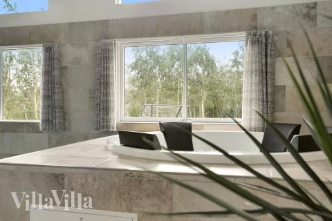 Genießen Sie den warmen Whirlpool im Luxusferienhaus Nr. 432 in Lolland/Falster/Mön