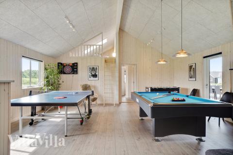 Neben den vielen schönen Stunden, die man im Poolbereich des Hauses verbringen kann, bietet das Luxusferienhaus 453 auch Spielevergnügen bei Billard/Tischtennis und Darts