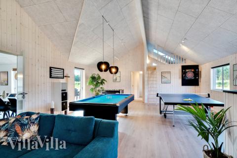 Neben den vielen schönen Stunden, die man im Poolbereich des Hauses verbringen kann, bietet das Luxusferienhaus 455 auch Spielevergnügen bei Billard/Tischtennis und Darts