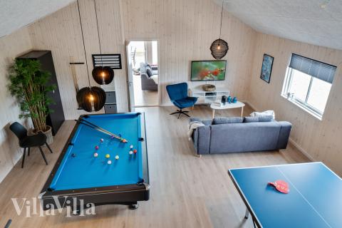 Neben den vielen schönen Stunden, die man im Poolbereich des Hauses verbringen kann, bietet das Luxusferienhaus 456 auch Spielevergnügen bei Billard/Tischtennis und Darts