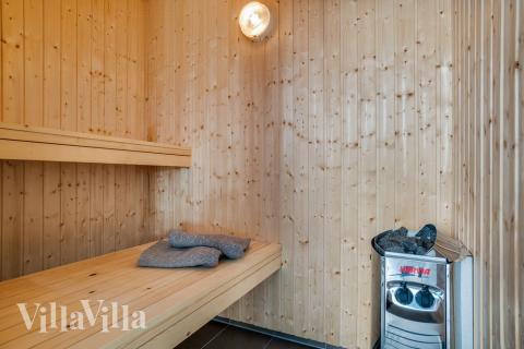 Genießen Sie die heiße Sauna im Luxusferienhaus Nr. 458 für 18 Personen