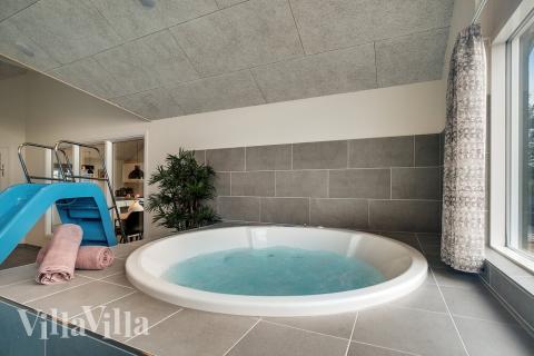 Genießen Sie den warmen Whirlpool im Luxusferienhaus Nr. 473 in Westjütland