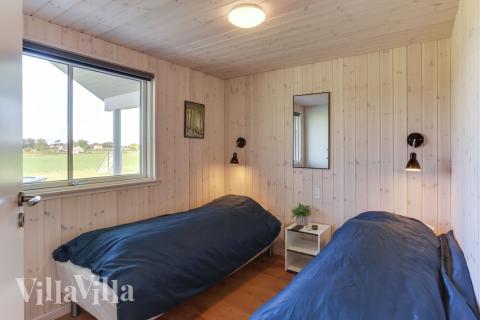 Eines der 9 Schlafzimmer im Luxusferienhaus Nr. 447