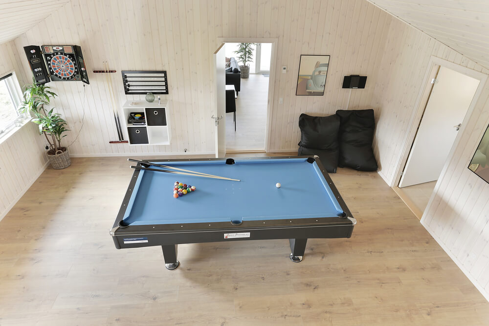 Neben den vielen schönen Stunden, die man im Poolbereich des Hauses verbringen kann, bietet das Luxusferienhaus 452 auch Spielevergnügen bei Billard/Tischtennis und Darts