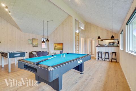 Neben den vielen schönen Stunden, die man im Poolbereich des Hauses verbringen kann, bietet das Luxusferienhaus 472 auch Spielevergnügen bei Billard/Tischtennis und Darts