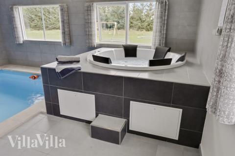 Genießen Sie den warmen Whirlpool im Luxusferienhaus Nr. 445 in Lolland/Falster/Mön