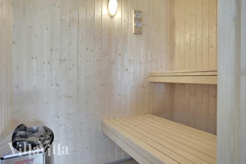 Genießen Sie die heiße Sauna im Luxusferienhaus Nr. 459 für 16 Personen