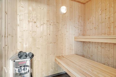 Genießen Sie die heiße Sauna im Luxusferienhaus Nr. 464 für 16 Personen