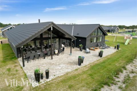 Dieses schöne Poolhaus Nr. 464 mit Platz für 16 Personen liegt in Westjütland