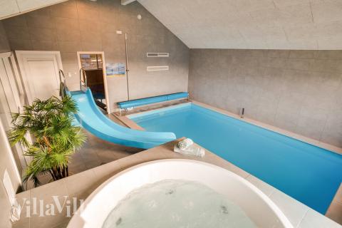 Genießen Sie den warmen Whirlpool im Luxusferienhaus Nr. 477 in Westjütland
