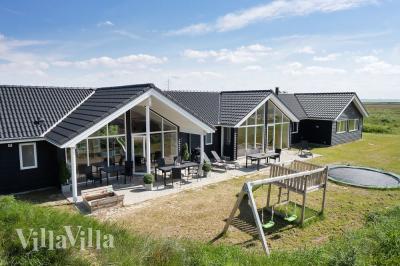 Dieses schöne Poolhaus Nr. 477 mit Platz für 18 Personen liegt in Westjütland