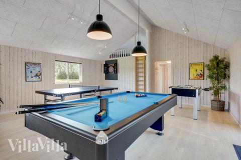 Neben den vielen schönen Stunden, die man im Poolbereich des Hauses verbringen kann, bietet das Luxusferienhaus 470 auch Spielevergnügen bei Billard/Tischtennis und Darts
