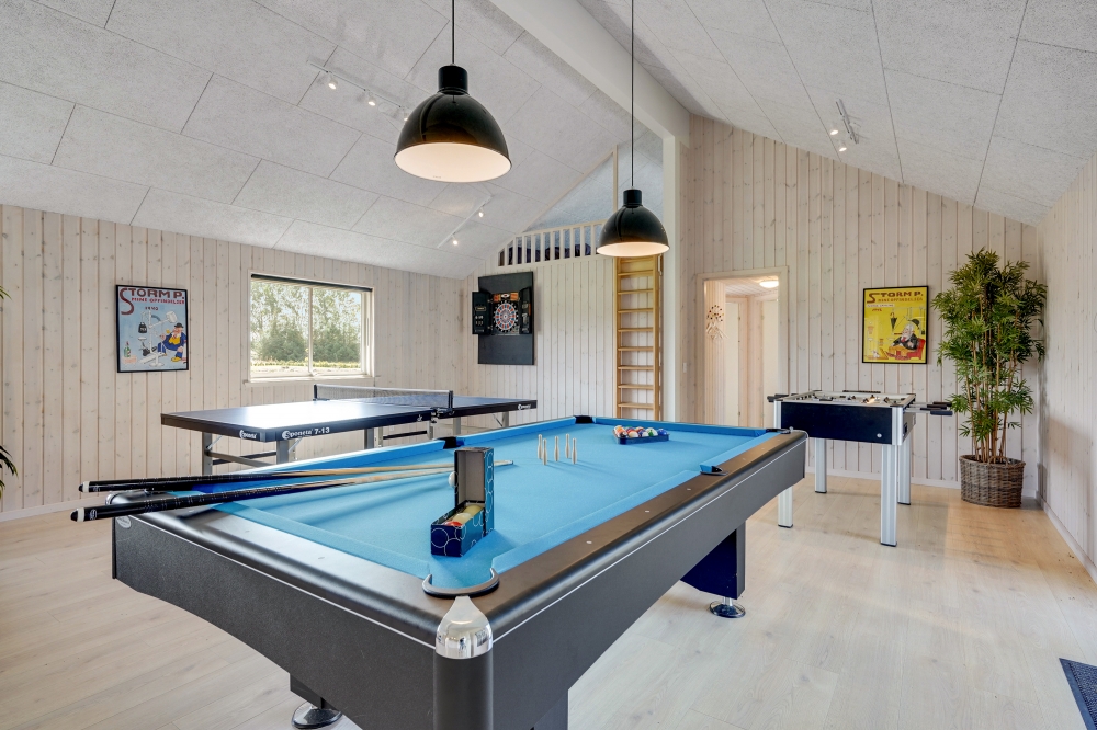 Neben den vielen schönen Stunden, die man im Poolbereich des Hauses verbringen kann, bietet das Luxusferienhaus 470 auch Spielevergnügen bei Billard/Tischtennis und Darts