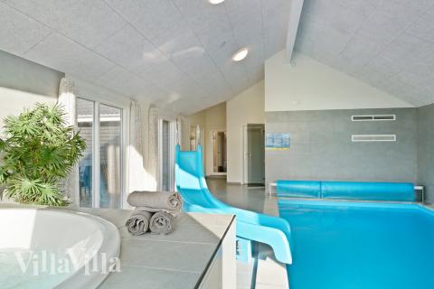 Genießen Sie den warmen Whirlpool im Luxusferienhaus Nr. 479 in Ostjütland