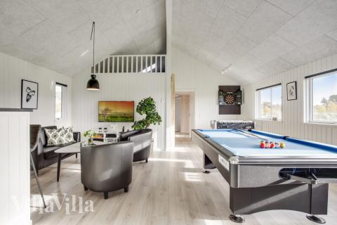 Neben den vielen schönen Stunden, die man im Poolbereich des Hauses verbringen kann, bietet das Luxusferienhaus 489 auch Spielevergnügen bei Billard/Tischtennis und Darts