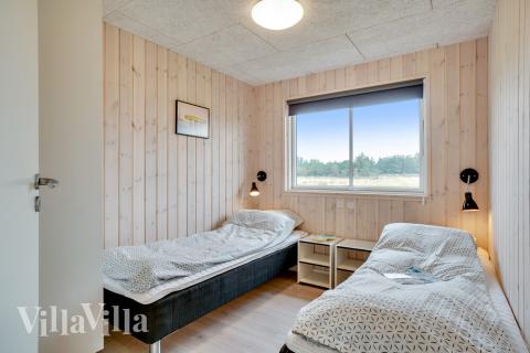 Eines der 7 Schlafzimmer im Luxusferienhaus Nr. 484