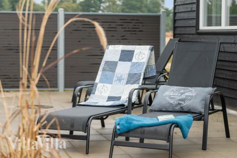 Genießen Sie einen Grillabend auf der Terrasse des Luxusferienhauses Nr. 484 in Westjütland