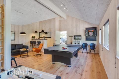 Neben den vielen schönen Stunden, die man im Poolbereich des Hauses verbringen kann, bietet das Luxusferienhaus 494 auch Spielevergnügen bei Billard/Tischtennis und Darts