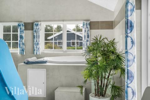 Genießen Sie den warmen Whirlpool im Luxusferienhaus Nr. 500 in Nordjütland