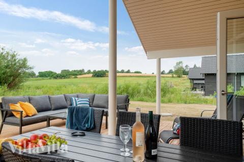 Genießen Sie einen Grillabend auf der Terrasse des Luxusferienhauses Nr. 501 in Nordseeland