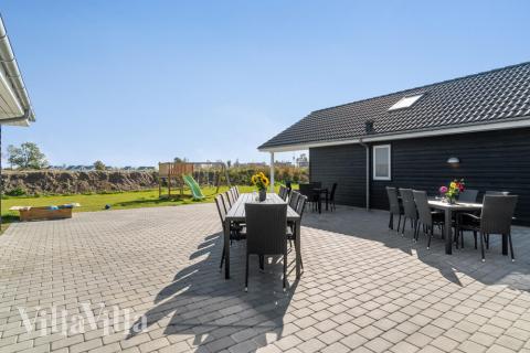 Genießen Sie einen Grillabend auf der Terrasse des Luxusferienhauses Nr. 729 in Deutschland