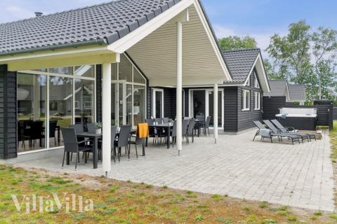 Genießen Sie einen Grillabend auf der Terrasse des Luxusferienhauses Nr. 513 in Lolland/Falster/Mön