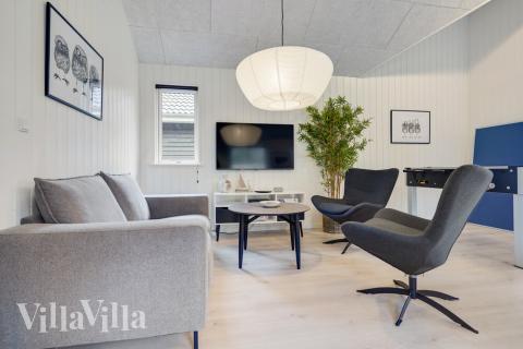 Die Couch im Luxusferienhaus Nr. 509 in Lolland/Falster/Mön lädt zu Gesellschaftsspielen oder zu Kinoabenden ein.